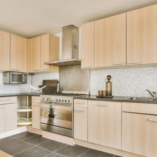 Cream colored kitchen cabinets