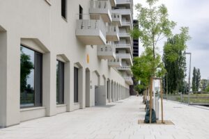 Commercial ground floor of building and pedestrian area, residential buildings, modern architecture